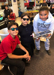 Students with solar sprint cars