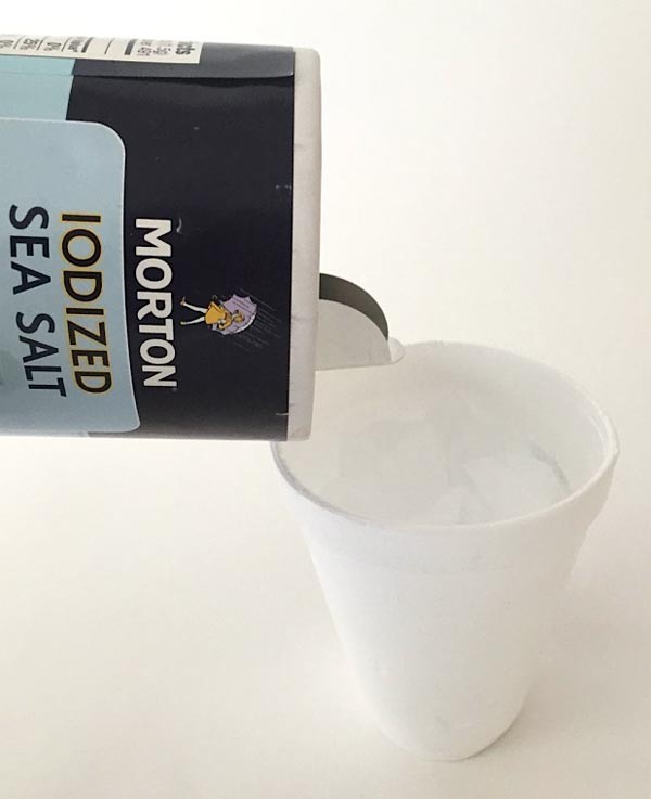 Cover the ice with table or sea salt