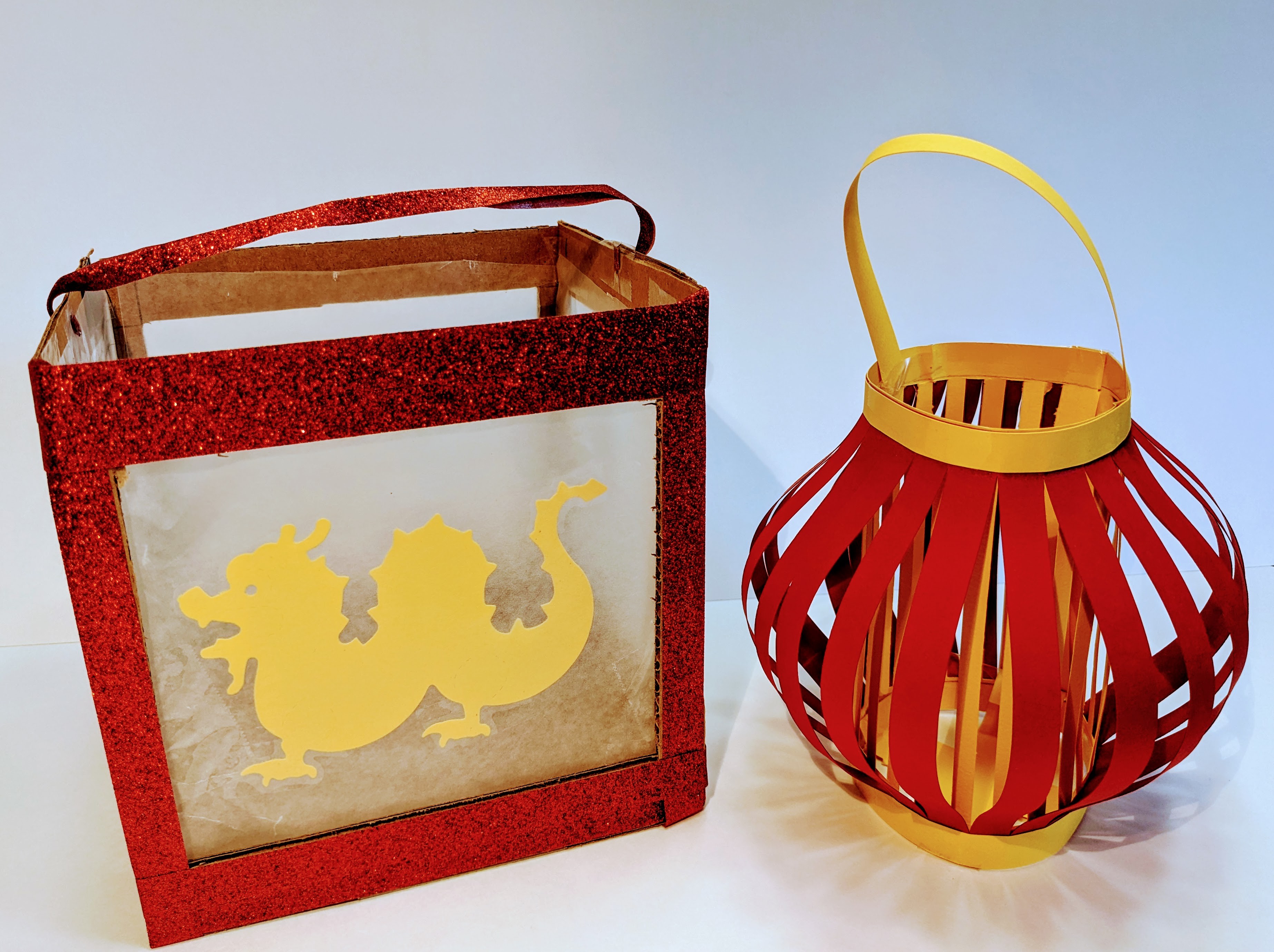Two red and yellow paper lanterns made for Lunar New Year.