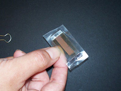 Two glass slides sandwiched together with one slightly offset from the other.  