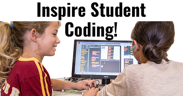 Two students working on a basic coding project using Scratch and Raspberry Pi