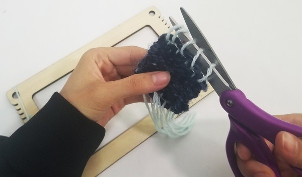 cutting loops that connected patch to loom.