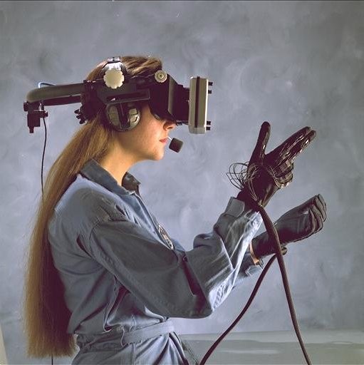 a person wearing a virtual reality headset and haptic gloves