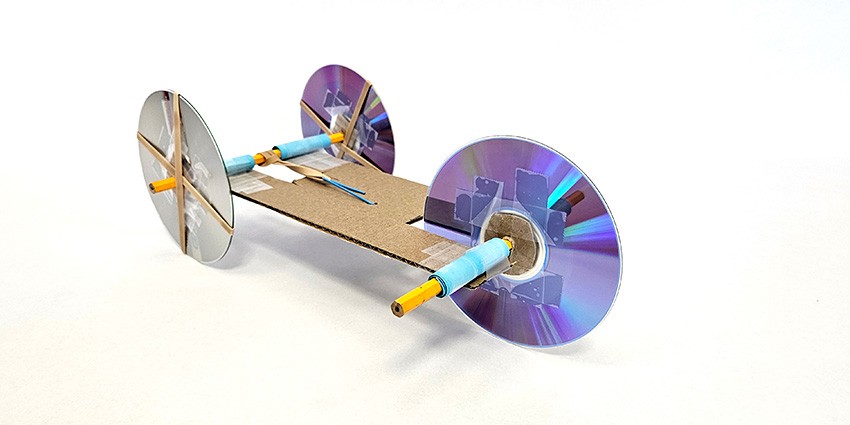 a rubber band powered car made from craft materials