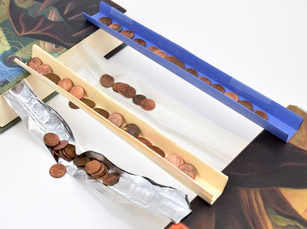 Testing the strength of bridges using pennies as weight