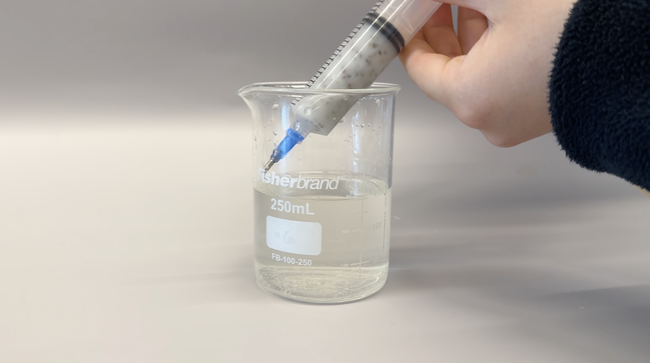 manual extrusion of chia seed solution into calcium chloride solution