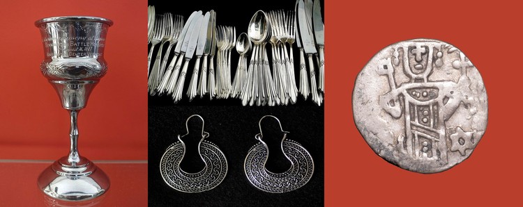 A silver ceremonial cup with a long stem, silver cutlery (forks, knives, and spoons), circular silver earrings, and an ancient silver coin with the outline of a person and several symbols. 
