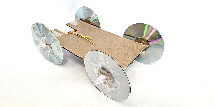 a rubber band powered car made from craft materials