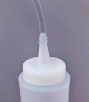 tube connected to the bottle opening