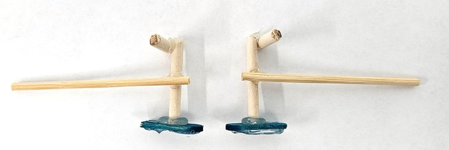 Legs for the walking robot made using wooden dowels, skewers, and popsicle sticks. 
