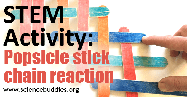 Interlaced popsicle sticks held down by a hand