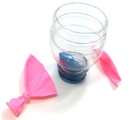   An upside down bottle with its bottom cut off, and a balloon where the top has been cut off. 