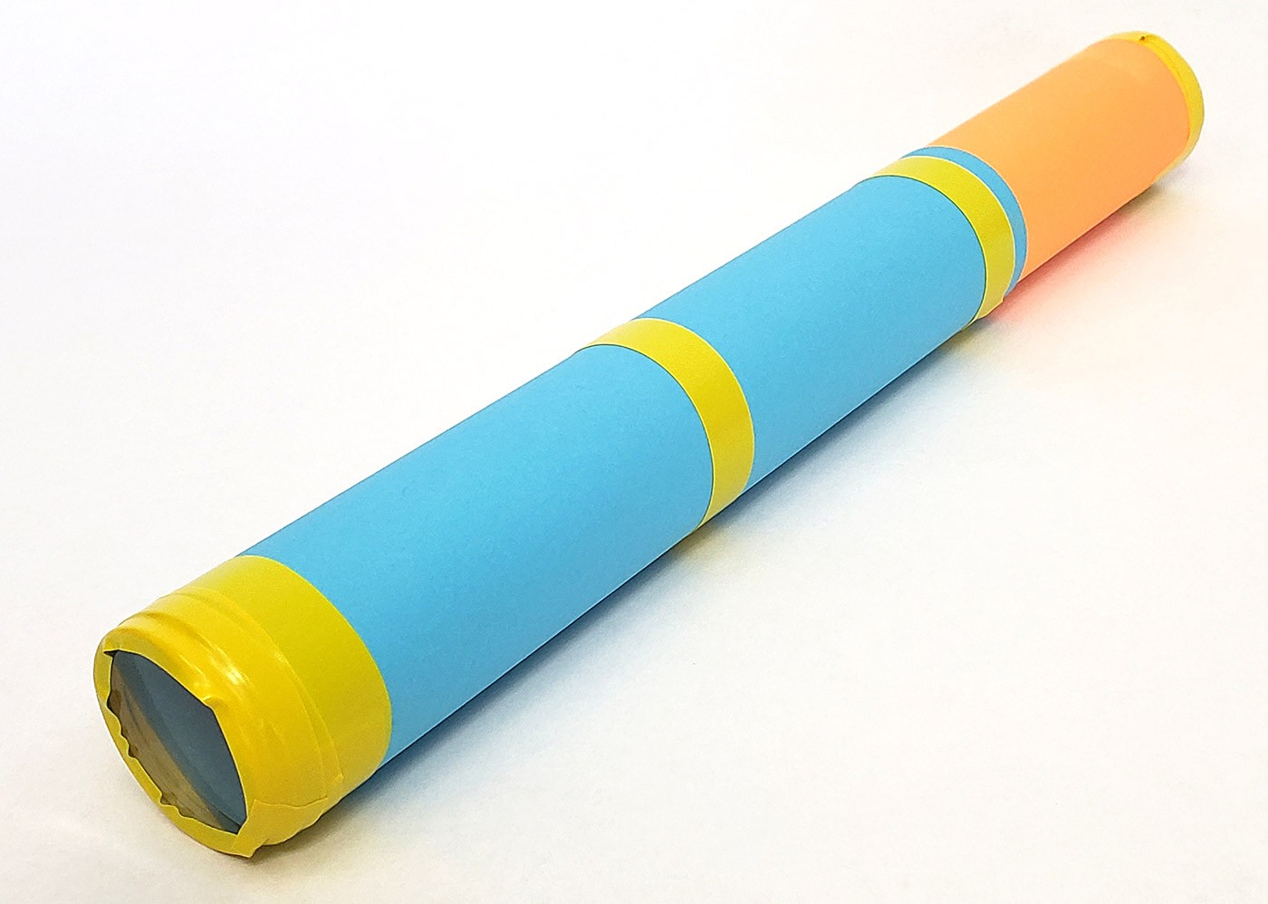 A bright cardstock tube with a lens taped to each end