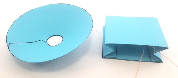 paper speaker cone next to speaker body