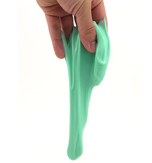 A hand holding a blob of slime that is dripping downwards.