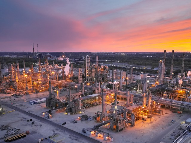 Industrial refinery site with remote sensors to monitor pollution