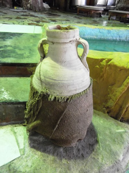 A clay jar wrapped on a coarse cloth