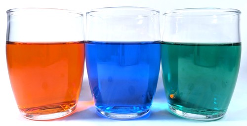 Glasses of red, blue, and green liquid