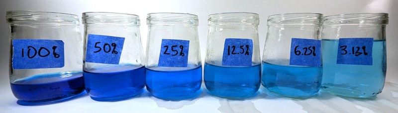 jars filled with blue liquid