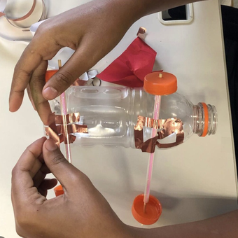 Student working on a balloon car from success story about teacher who did engineering design and computer science projects with middle school students