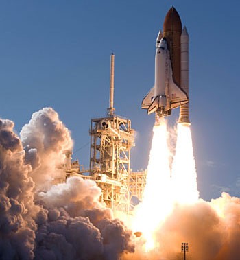 Photo of a rocket and spaceshuttle during takeoff