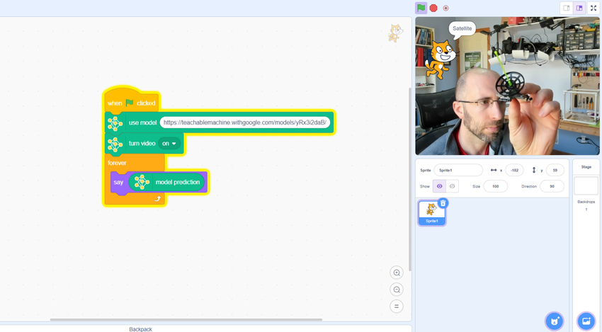 A teachable machine model in Scratch identifying a model satellite