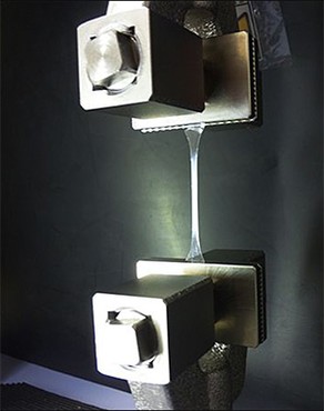  The left image shows how a machine stretches a polymer strand.  