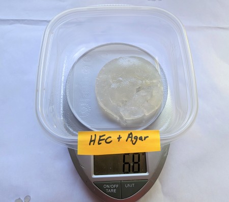 Biodegradable hydrogel sitting in a container on a scale.