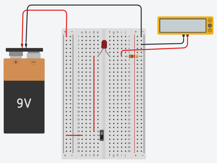 Multimeter connected to measure resistor voltage in the LED circuit. 