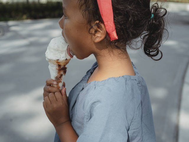 kid licking ice cream