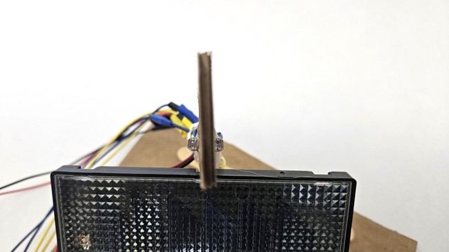 Edge-on view of the cardboard with both photoresistors visible