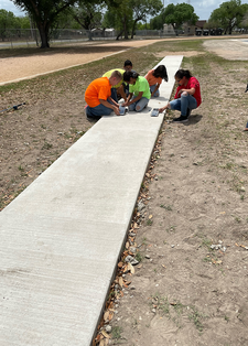 Students ready to race and test solar sprint cars outside