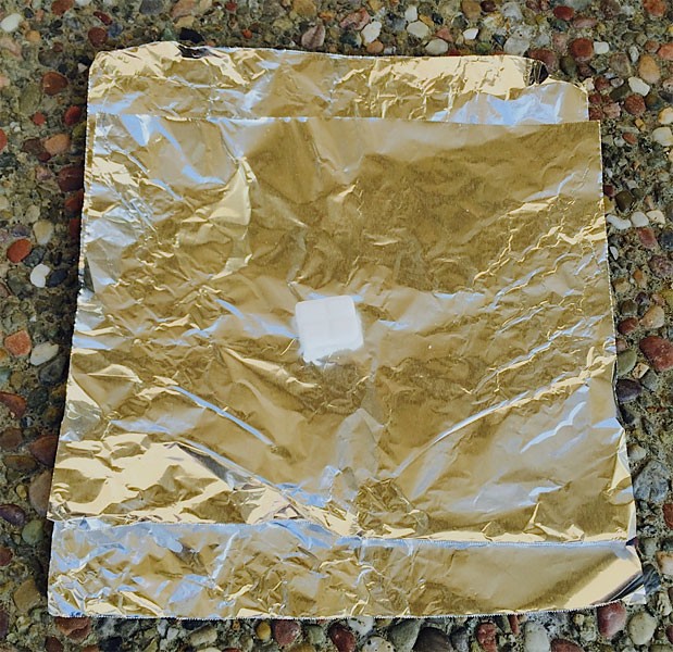 Place one fuel tablet on a square of aluminum foil 