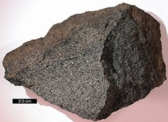  jagged igneous rock with grainy, sparkly appearance, no visible layers 