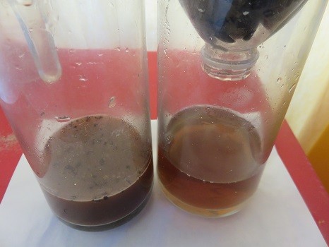 Two bottles filled with dirty water