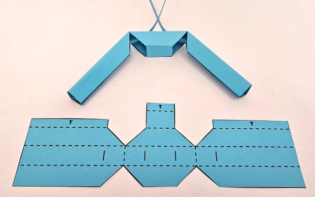 A robotic gripper made of folded paper. 