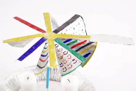 A small aluminum strip is added to a blade on a windmill to increase its length from the center