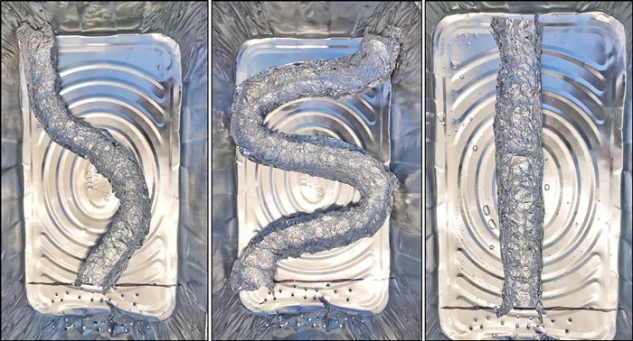 Three aluminum pans with a straight, a curved and a slightly bent aluminum foil river model.