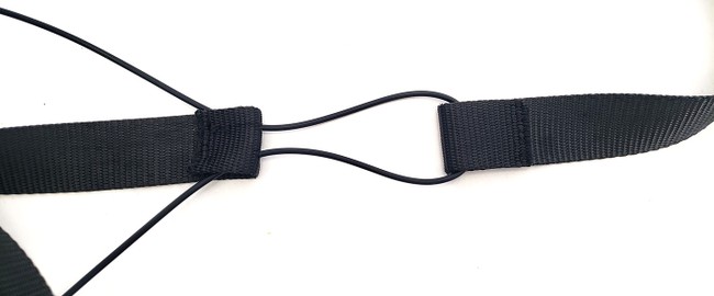 Strap with rubber cord threaded through the two casings. 