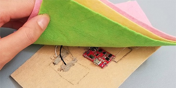 Wearable Air Quality Index Monitor Black and white wires connected on base patch.