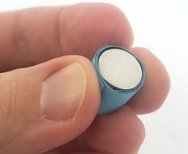strip of paper wrapped around magnet 