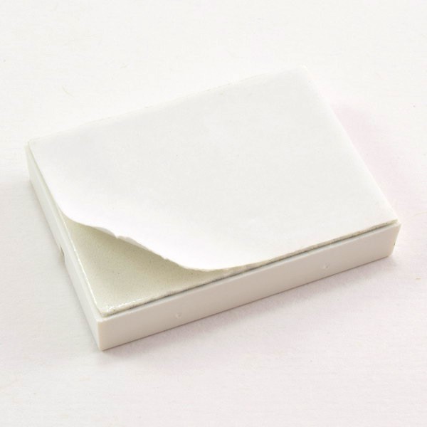 Peel the paper backing off the bottom of the breadboard 