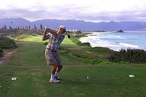 Photo of a golfer ready to swing a driver