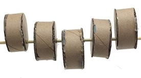 Side view of 5 short cylinders threaded onto a skewer. The cylinders are mounted such that their tops form a wide V shape.