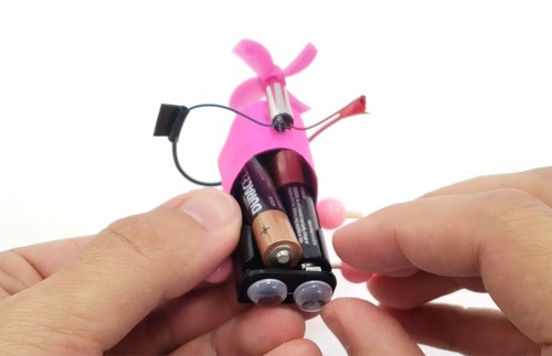 battery partially removed from battery pack 
