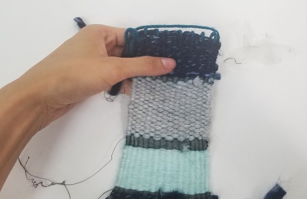 Massaging patch to even out weft distribution.