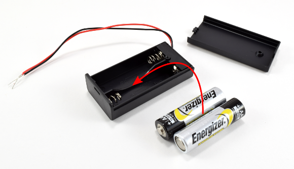 Two double A batteries are placed in a plastic battery pack