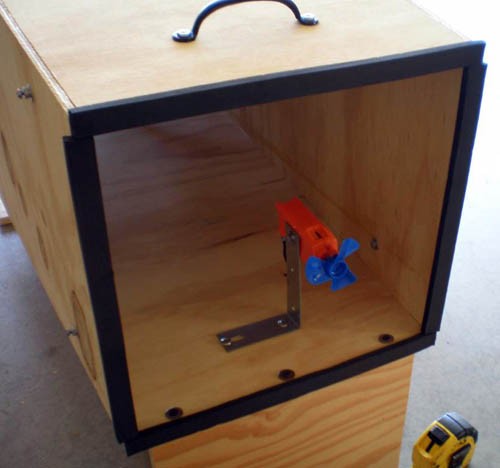 A wind speed sensor is mounted on a corner bracket and slightly off-center within the front of a diffuser