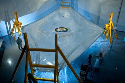A large sunshield membrane stretched across a room