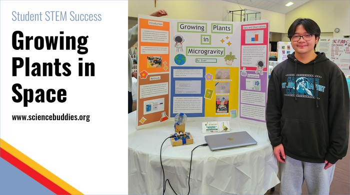 Student with clinostat microgravity plant science project and display board at the school's STEM fair